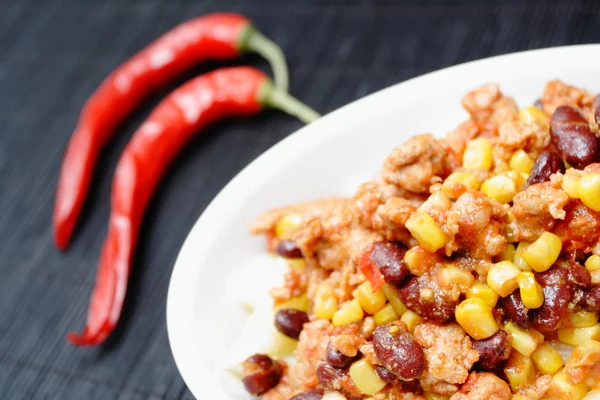 stock image Chili con carne and red peppers