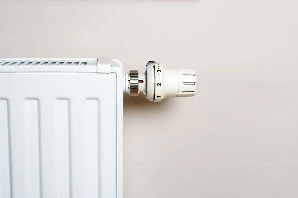 Radiator with thermostat on wall — Stock Photo, Image