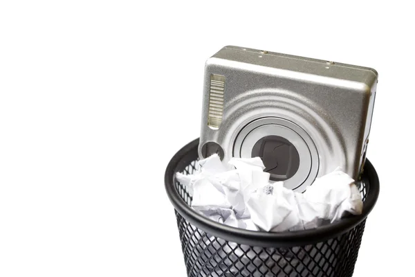 Digital camera in trashcan — Stock Photo, Image