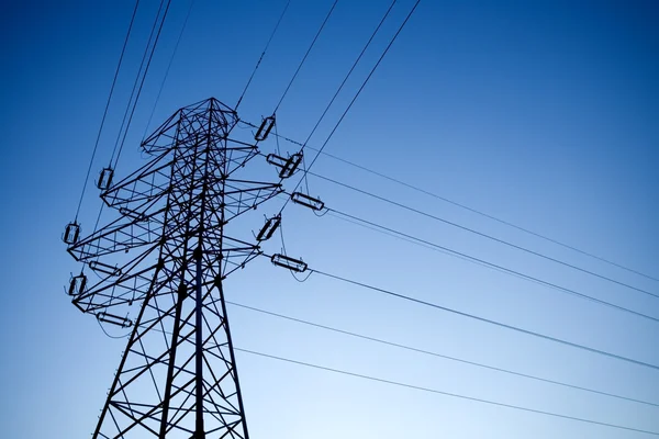 Silhouette of electrical pylon — Stock Photo, Image