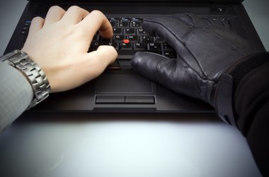 Computer theft on laptop keyboard clipart