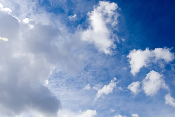 White clouds over vivid blue sky — Stock Photo, Image