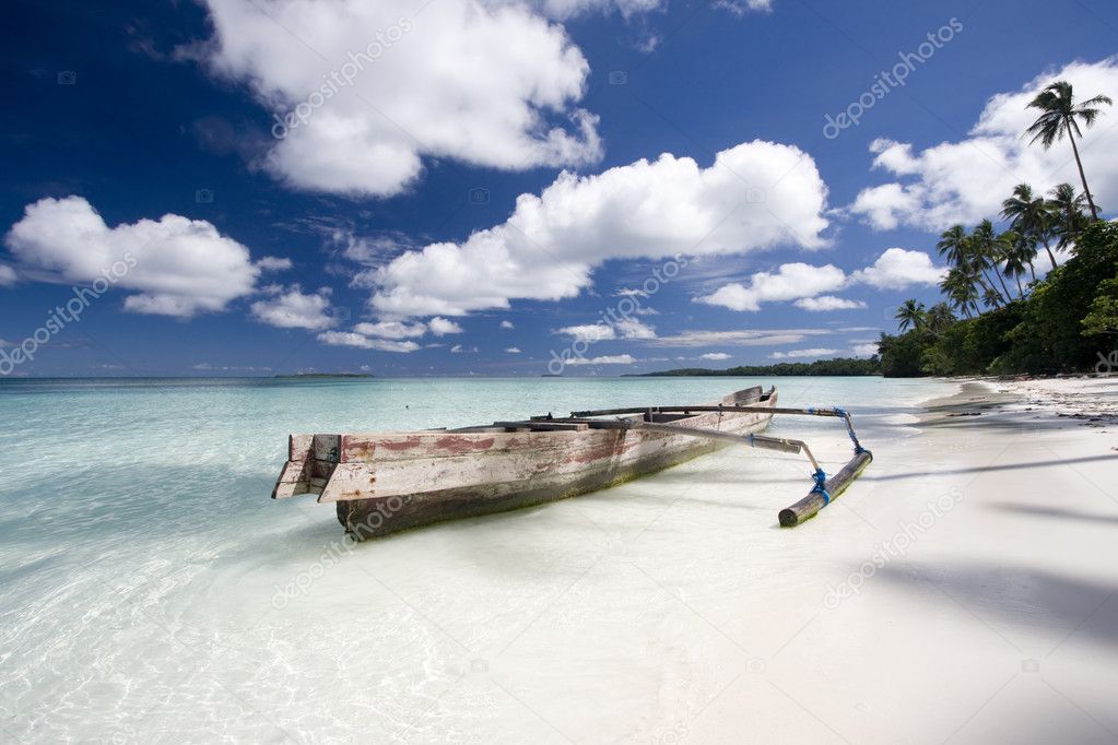 White sand beach with boat