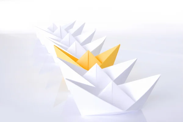 Yellow paper boat in queue — Stock Photo, Image