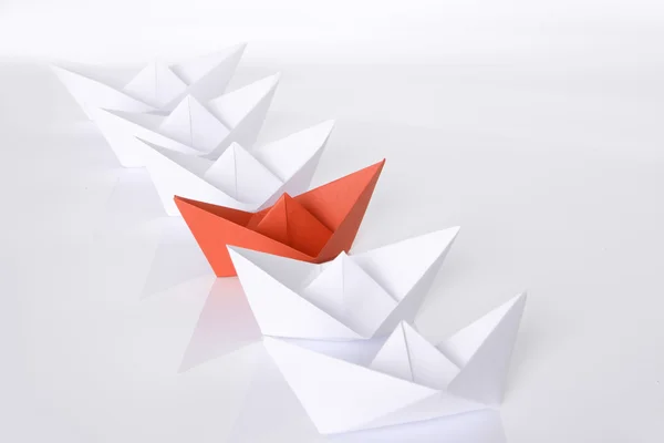 Red paper boat in queue — Stock Photo, Image