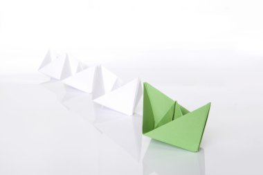 Winning green paper boat origami clipart