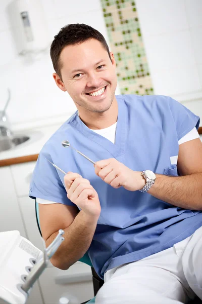 Smiling Dentist in his office — Stock Photo, Image