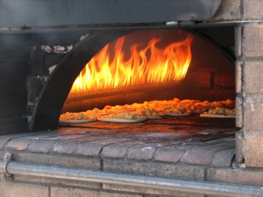 Pizza in old stove, oven clipart