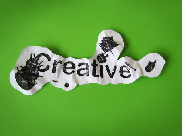 Palavra criativa cortada de papel — Fotografia de Stock