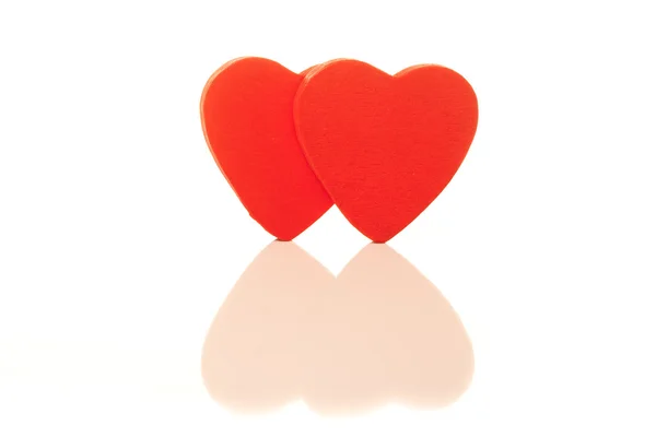 หัวใจสีแดงสองดวงที่มีแสงจ้า — ภาพถ่ายสต็อก