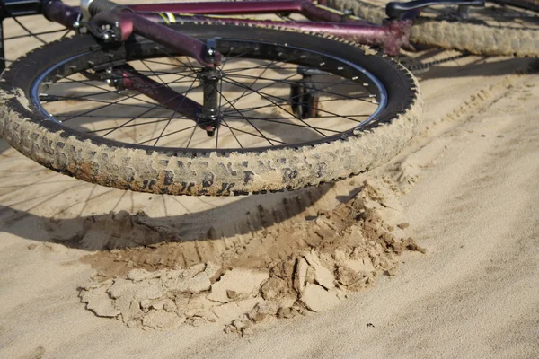 stock image Bike laying on a sand close up