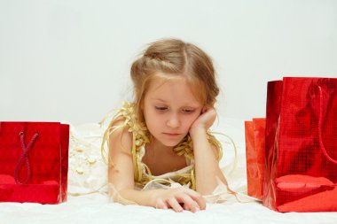 Sad girl with her gifts clipart