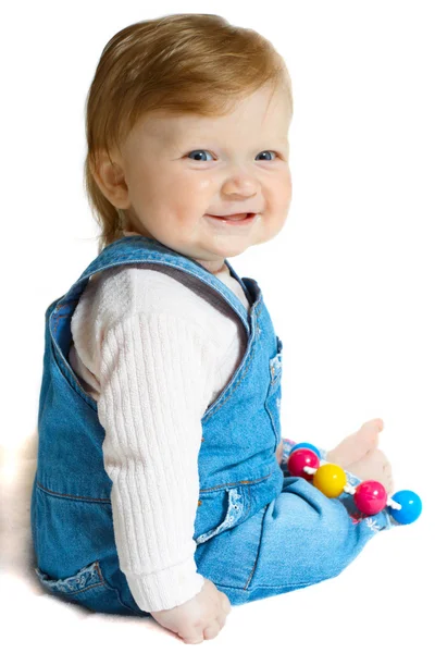Criança sorridente em terno de calça de ganga — Fotografia de Stock