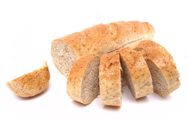 Cutted long loaf with bran — Stock Photo, Image
