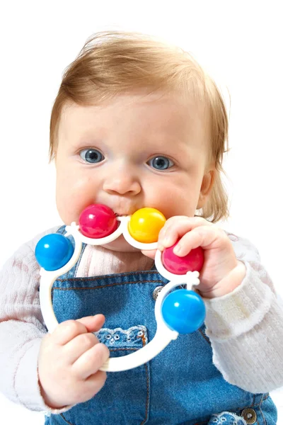 Dziecko w dżinsy garnitur z zabawkami — Zdjęcie stockowe