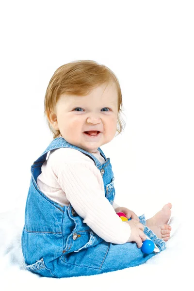 Дитина в джинсовому костюмі з іграшкою — стокове фото
