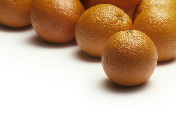 Oranges on a white surface — Stock Photo, Image