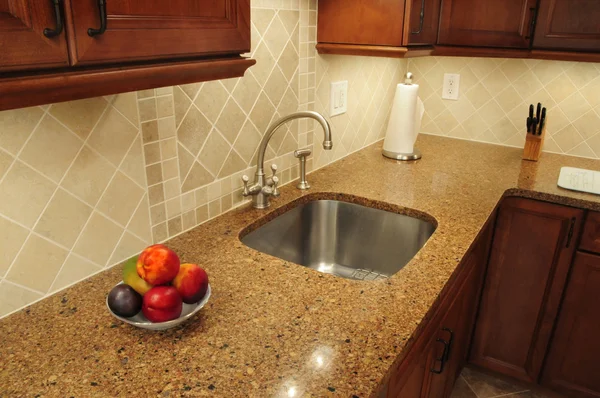 Steel sink in a remodeled kitchen — Stock Photo, Image