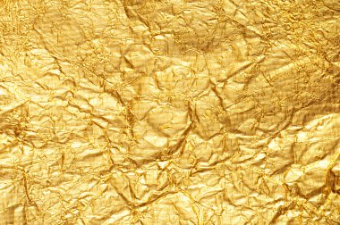 Crumpled gold foil textured background clipart