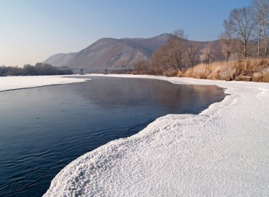 River Ussuri in the winter morning clipart