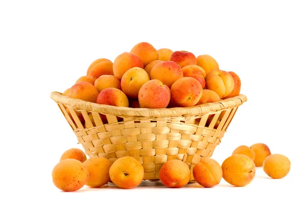 Apricots in a wicker basket — Stock Photo, Image