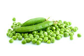 Pile of green peas and pair of pods