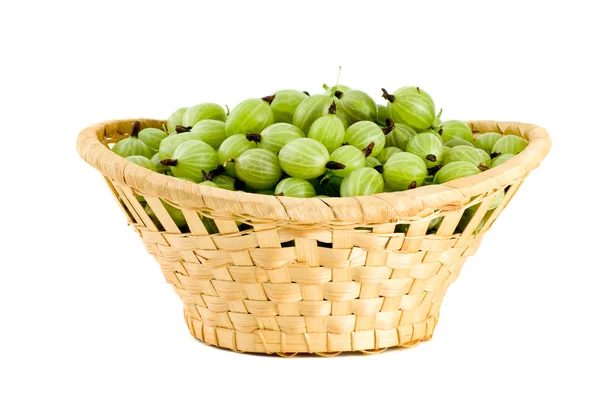 Wicker basket with gooseberries — Stock Photo, Image