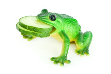 Toy frog with cucumber slices in mouth clipart