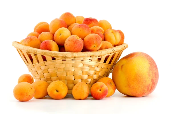 Pear and apricots in basket — Stock Photo, Image