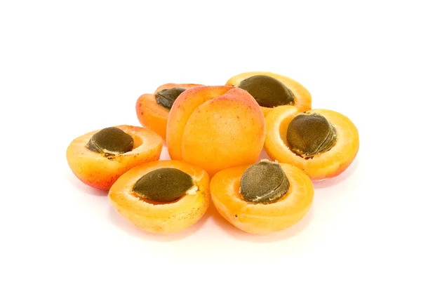 One whole and six apricot halves — Stock Photo, Image