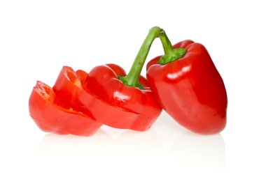 Sliced and whole red sweet peppers clipart