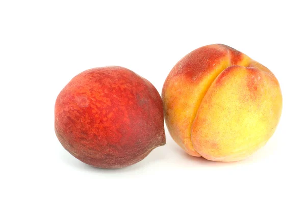 Naranja y melocotones rojos — Foto de Stock