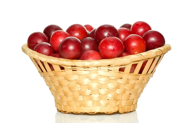 stock image Wicker basket with cherry plums