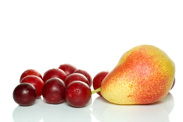 Yellow-red pear and some cherry plums — Stock Photo, Image