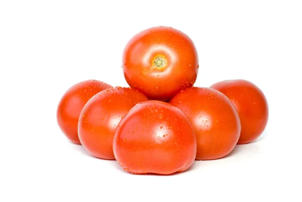 Pilha de tomates com gotas de água — Fotografia de Stock