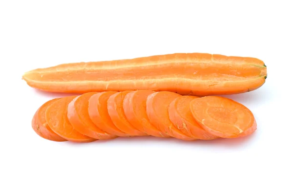 Half of carrot and some slices — Stock Photo, Image