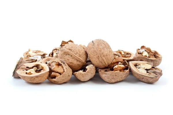 Cracked and whole walnuts — Stock Photo, Image