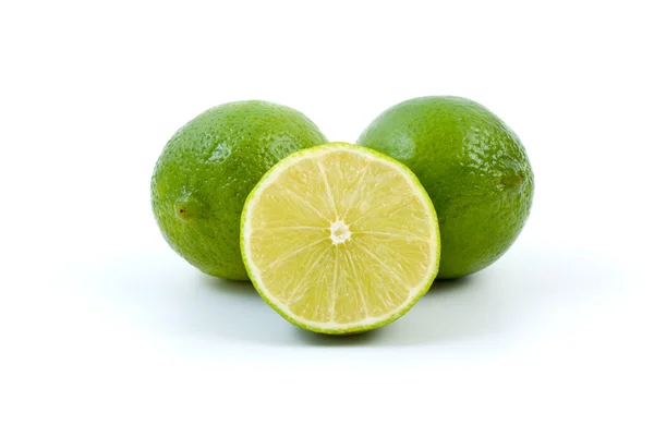 Limes. Whole and half — Stock Photo, Image