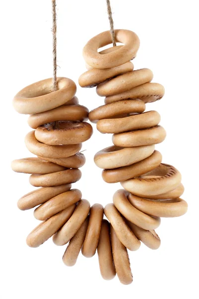 Några bröd-ringar hängande på rep — Stockfoto