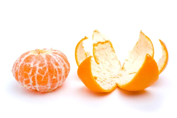 Peeled tangerine and peel — Stock Photo, Image