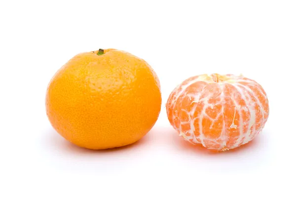 Whole and peeled tangerine — Stock Photo, Image