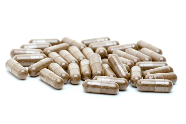 Algumas pílulas castanhas homeopáticas — Fotografia de Stock