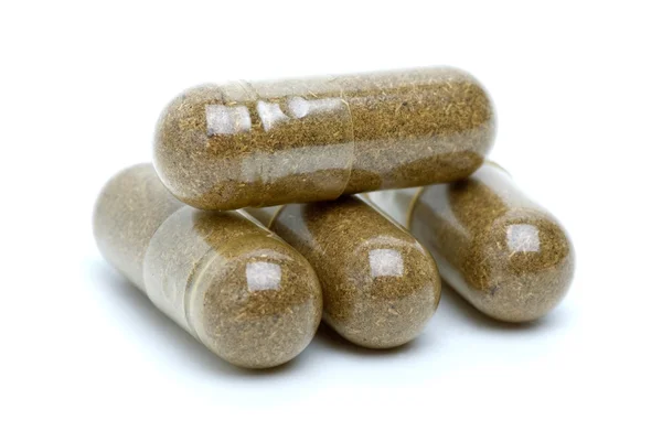 Vier bruin homeopathische pillen — Stockfoto