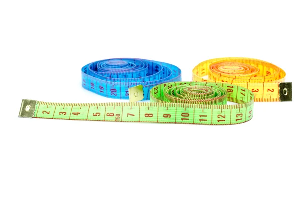 Three rolled measuring tapes — Stock Photo, Image