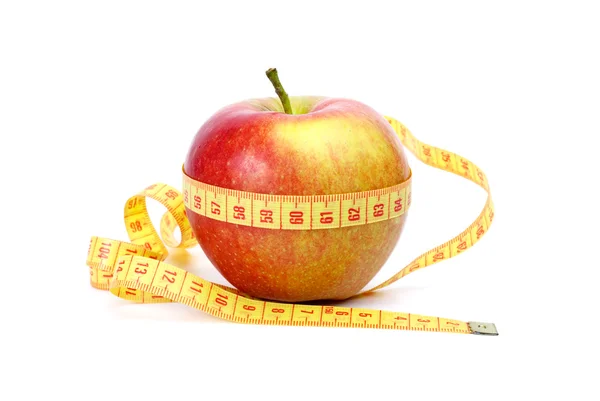 Żółto czerwone jabłko i pomiaru taśmą — Zdjęcie stockowe