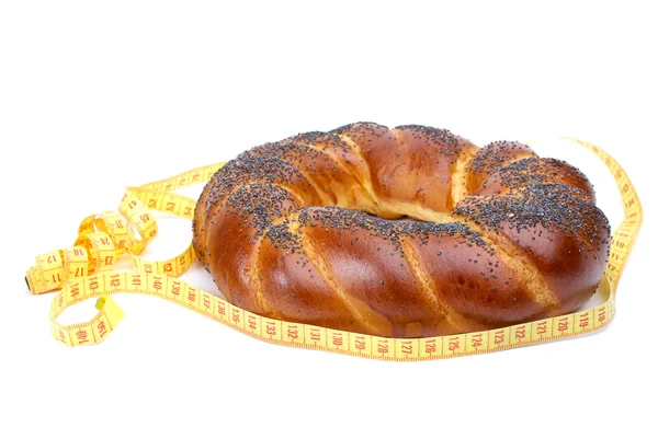 Fancy loaf and measurement tape — Stock Photo, Image