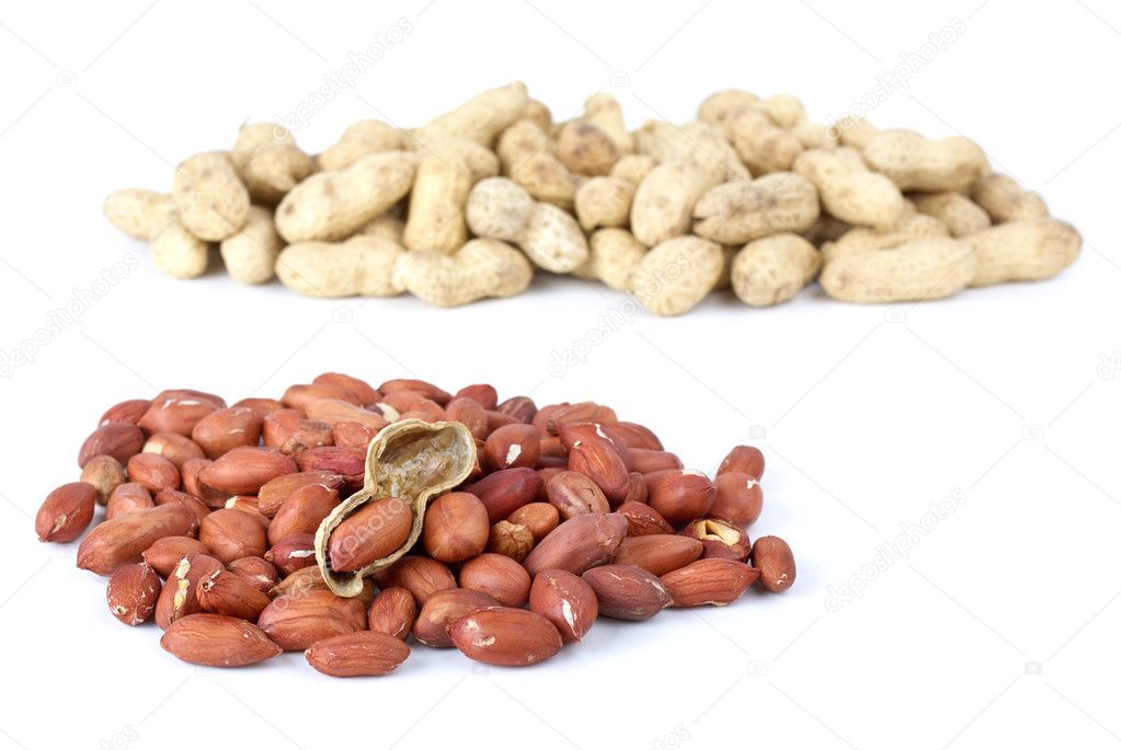 Shelled roasted peanuts and some husk