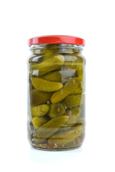 Glass jar with marinated cornichons — Stock Photo, Image