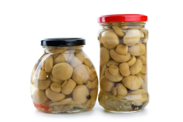 Glass jars with marinated champignons — Stock Photo, Image