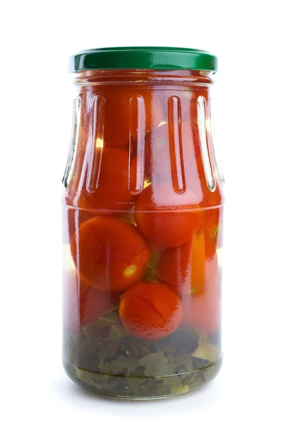 Glass jar with marinated cherry tomatoes — Stock Photo, Image
